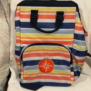 Backpack with bright horizontal stripes and front pocket with compass patch